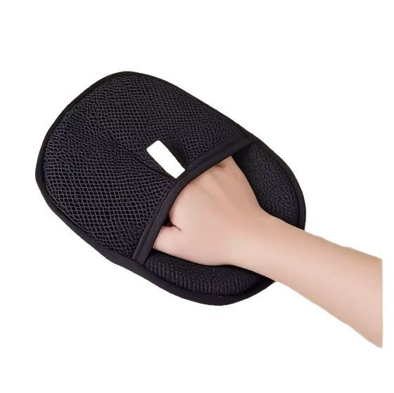 The mitt worn on a hand, showing the adjustable strap across the back.
