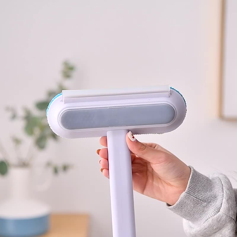 The brush head held in one hand, showing its size.